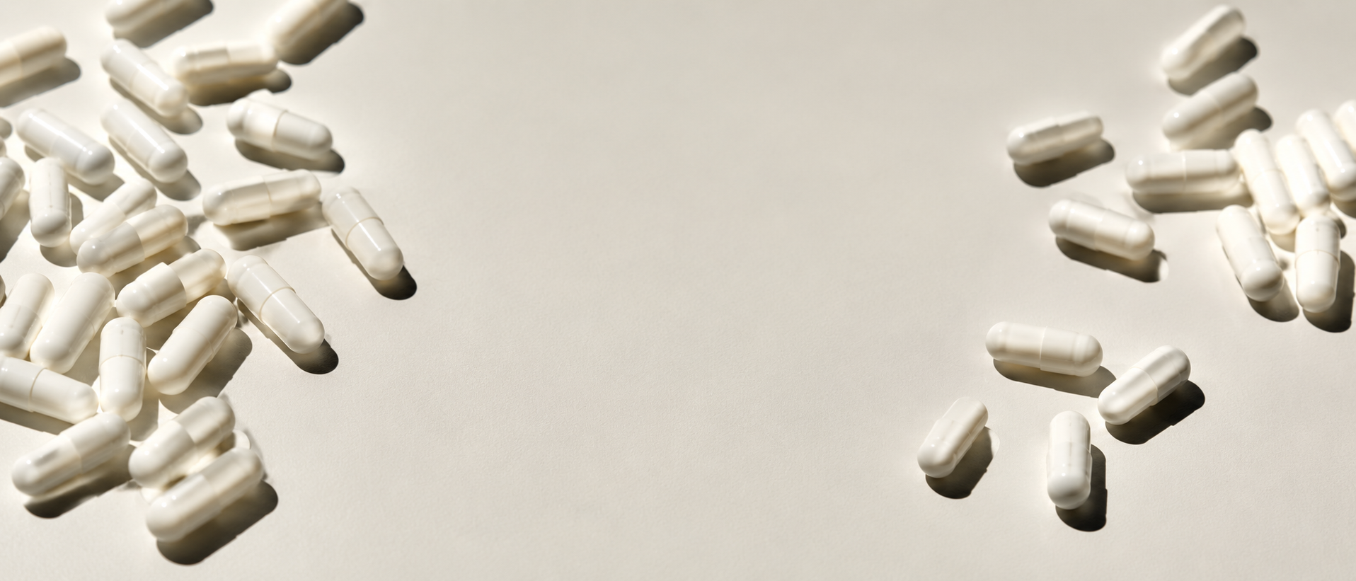 White capsules arranged in three groups