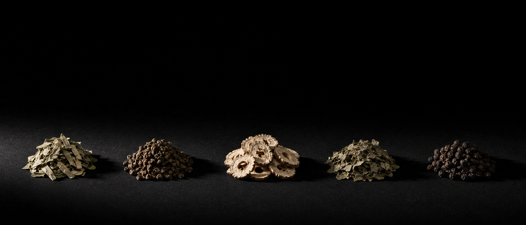 Five separate piles of dried botanical material in a row